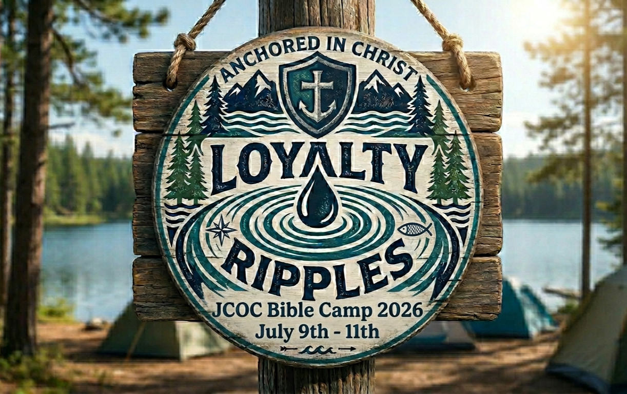Loyalty Ripples — Anchored in Christ wooden sign hanging by a lakeside camp